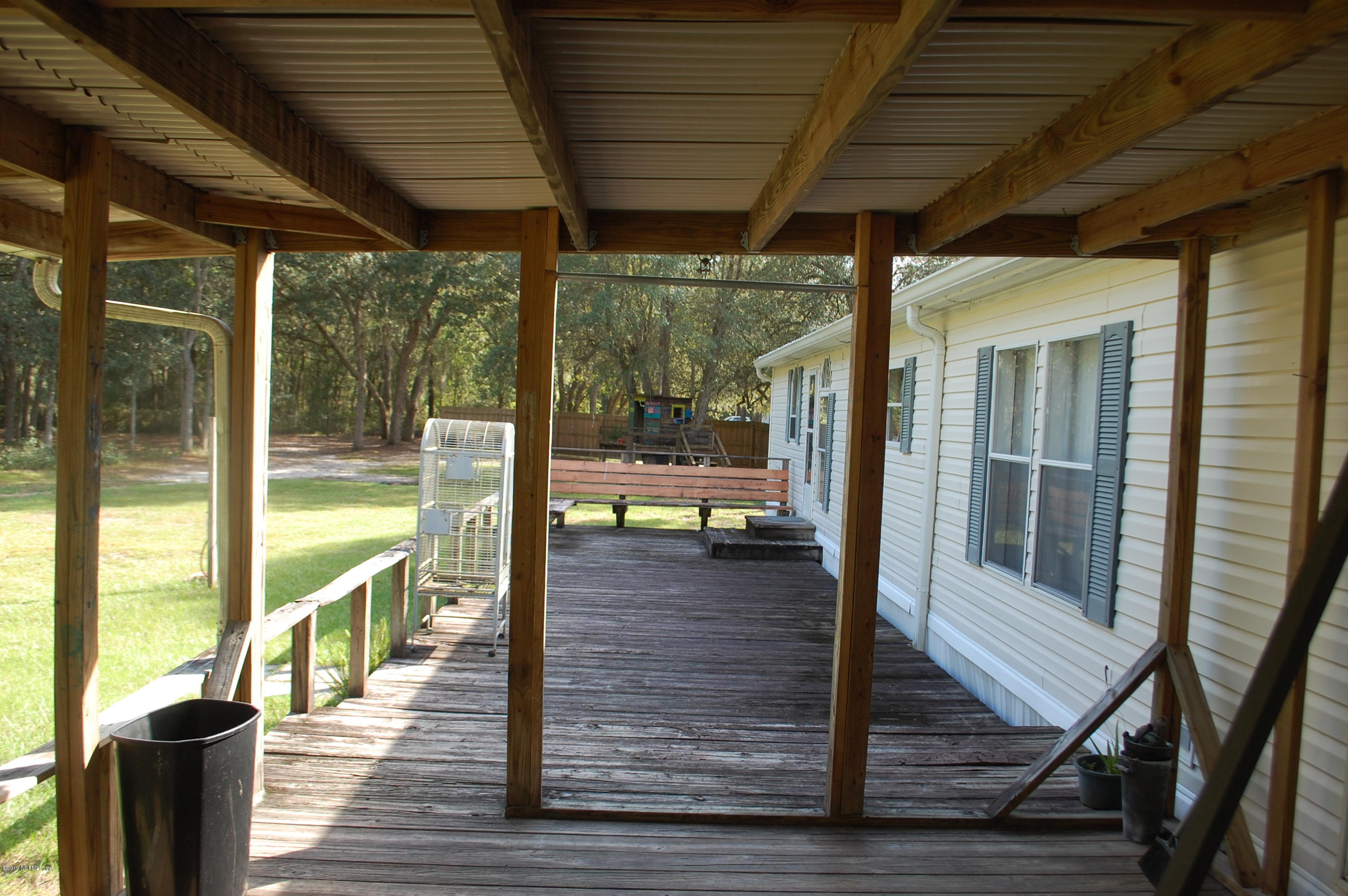 622 Lake Susan Road Hawthorne, FL 32640 - Photo 45 of 50 a view of a balcony with wooden floor
