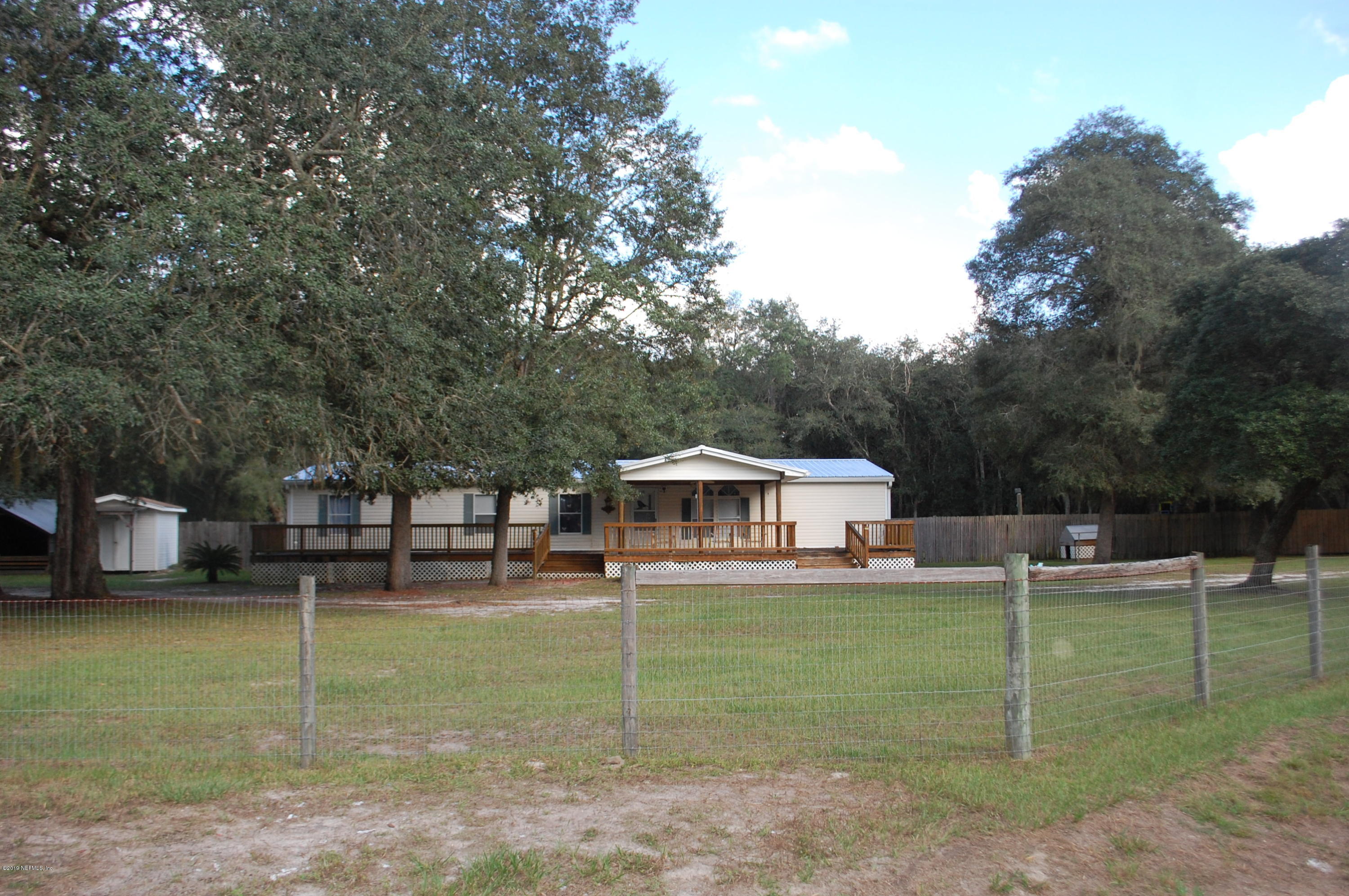 622 Lake Susan Road Hawthorne, FL 32640 - Photo 49 of 50 a view of a house with a yard