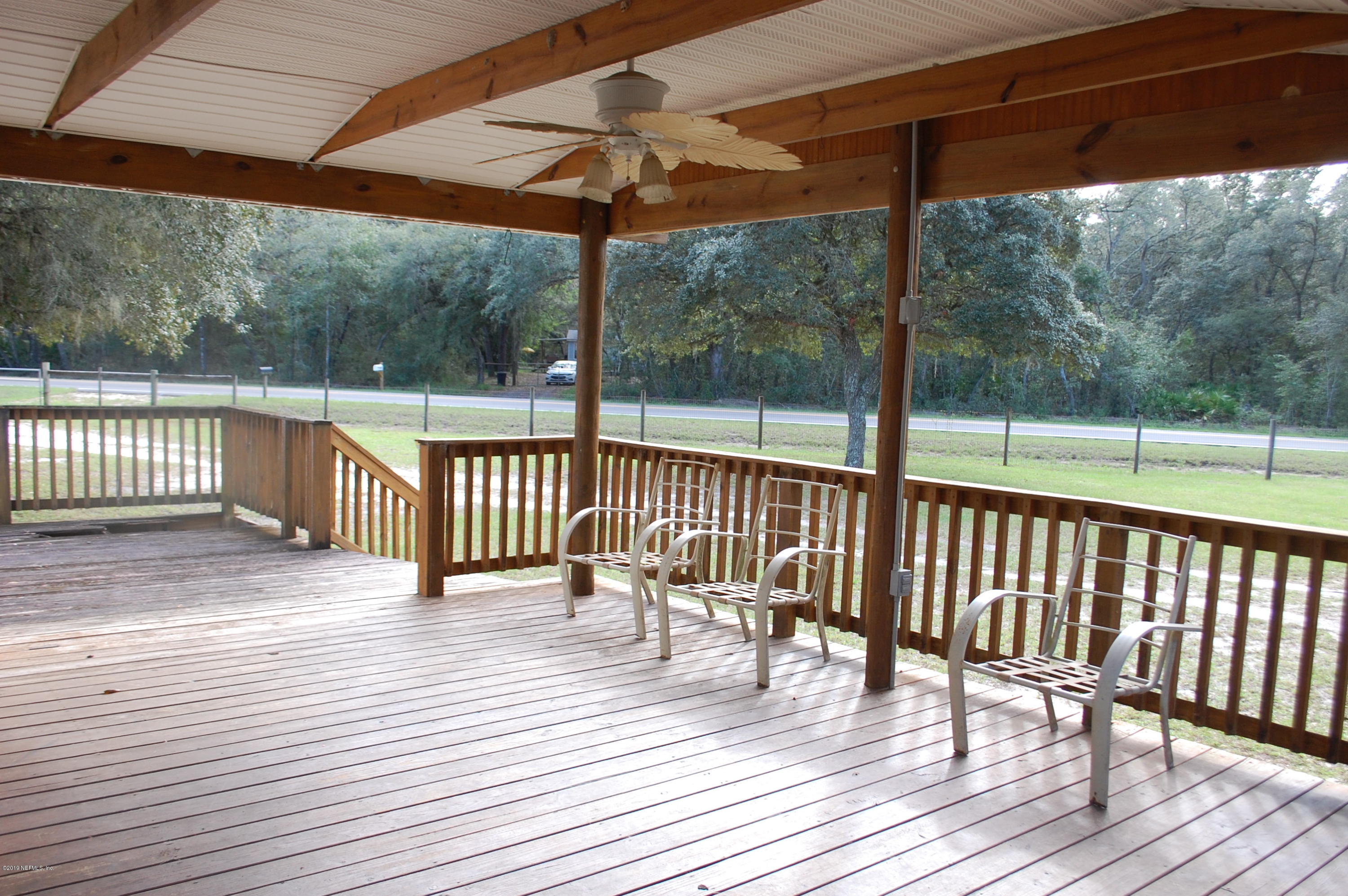622 Lake Susan Road Hawthorne, FL 32640 - Photo 7 of 50 a view of a deck with wooden floor and outdoor space