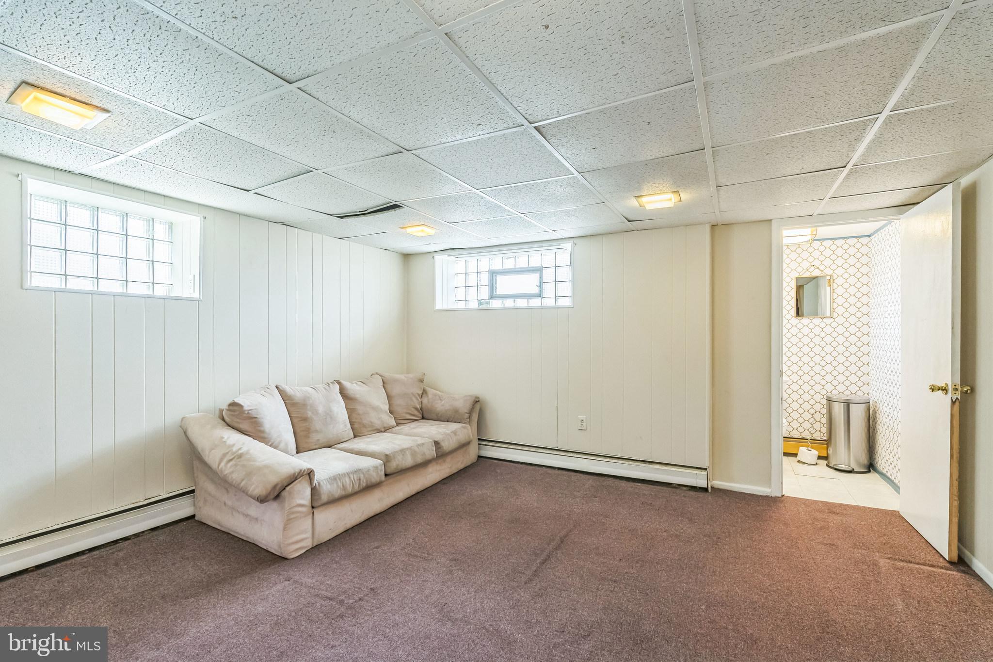 855 Medway Road Philadelphia, PA 19115 - Photo 12 of 30 a living room with furniture and a ceiling fan