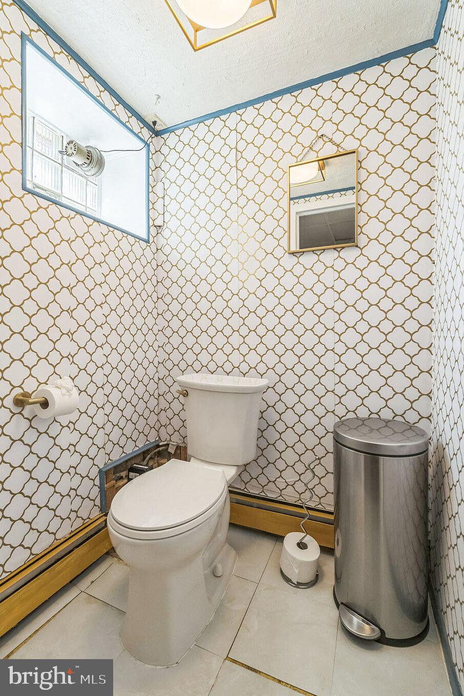 855 Medway Road Philadelphia, PA 19115 - Photo 13 of 30 a bathroom with a toilet and a shower curtain