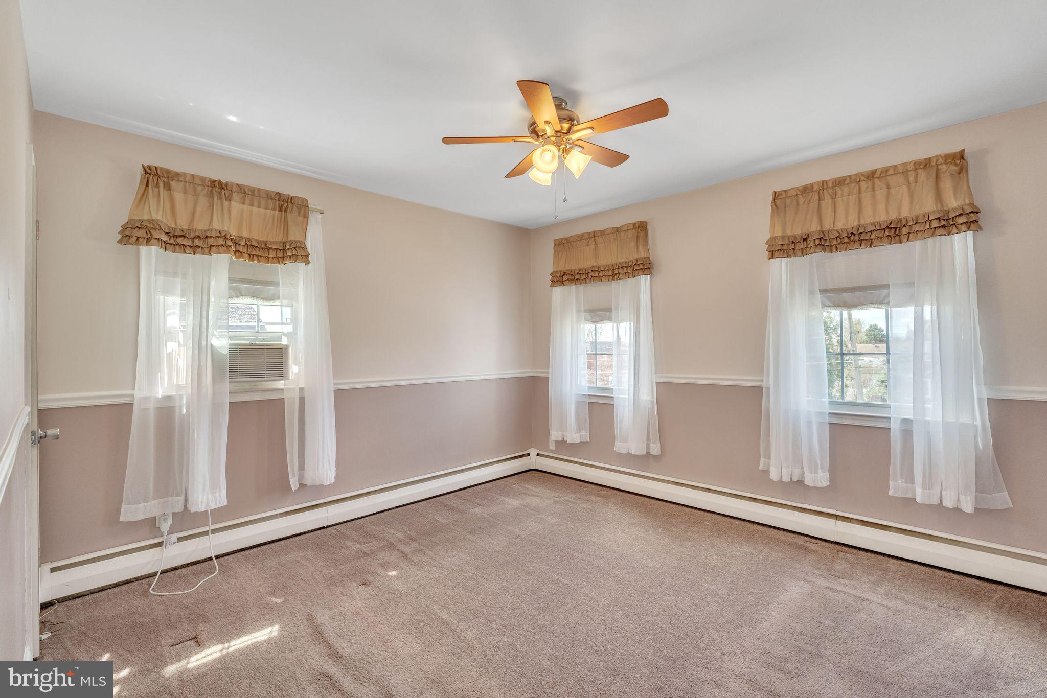 855 Medway Road Philadelphia, PA 19115 - Photo 17 of 30 an empty room with windows and cabinet