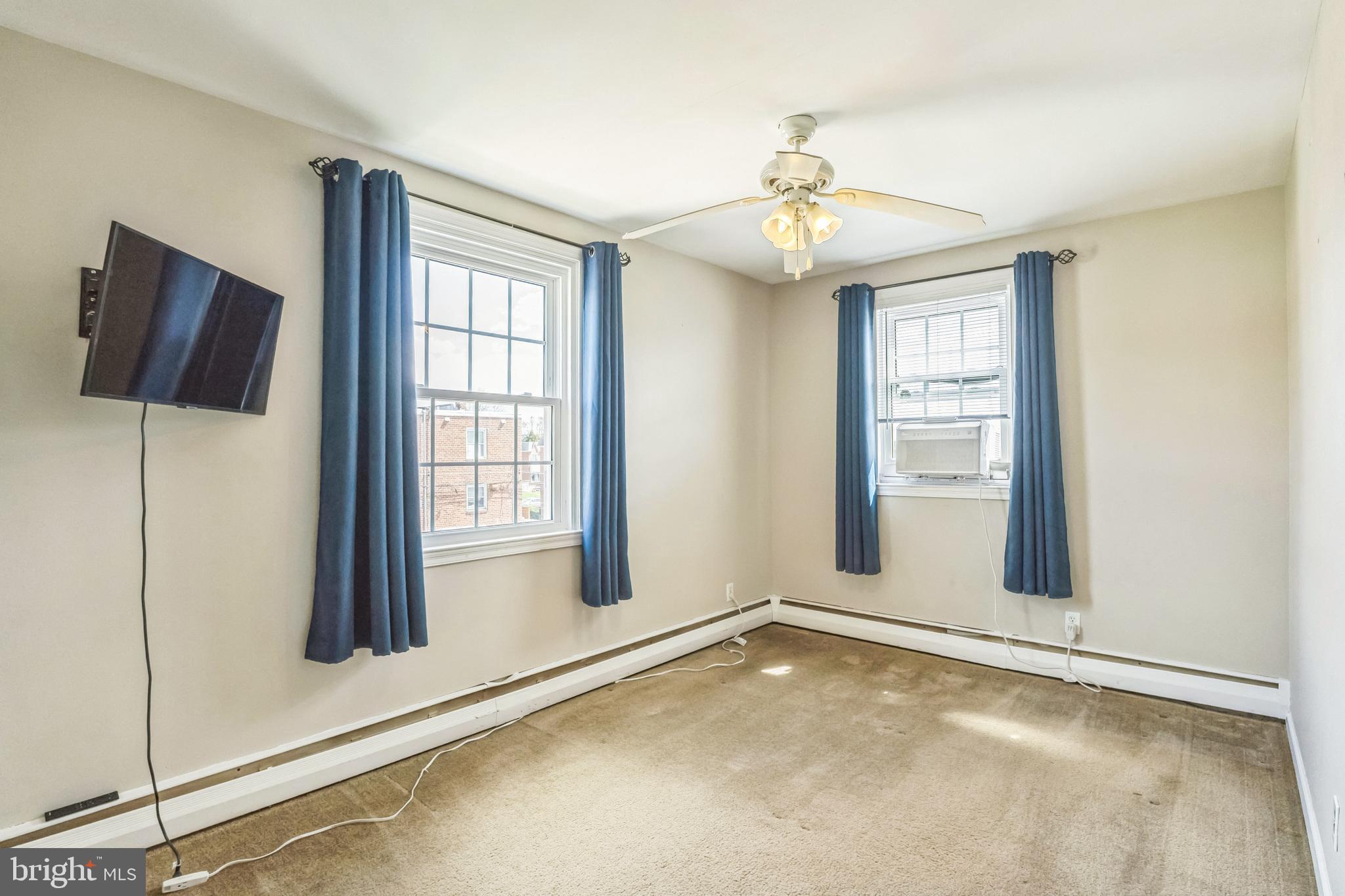 855 Medway Road Philadelphia, PA 19115 - Photo 18 of 30 an empty room with windows and fan