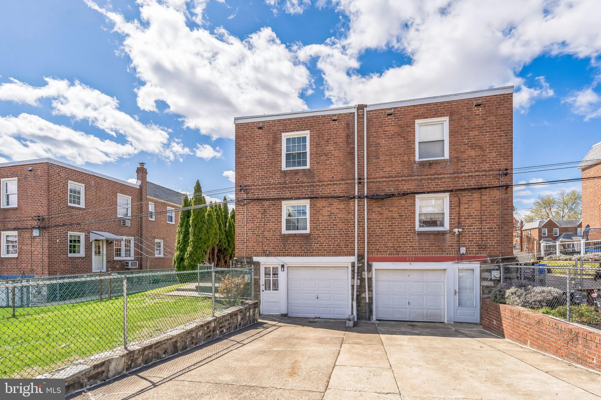855 Medway Road Philadelphia, PA 19115 - Photo 27 of 30 a view of a building with a yard