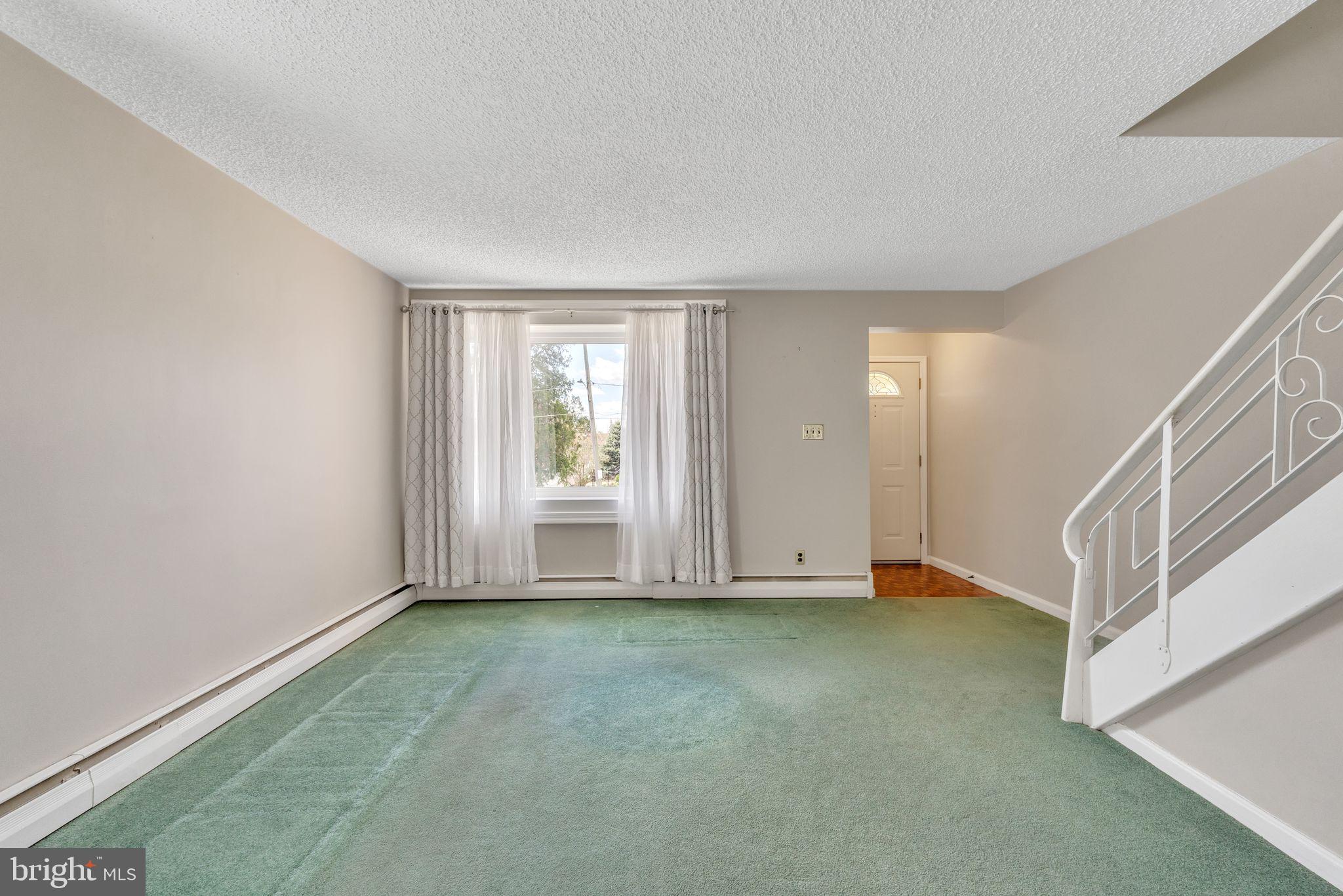 855 Medway Road Philadelphia, PA 19115 - Photo 4 of 30 a view of an empty room with a window