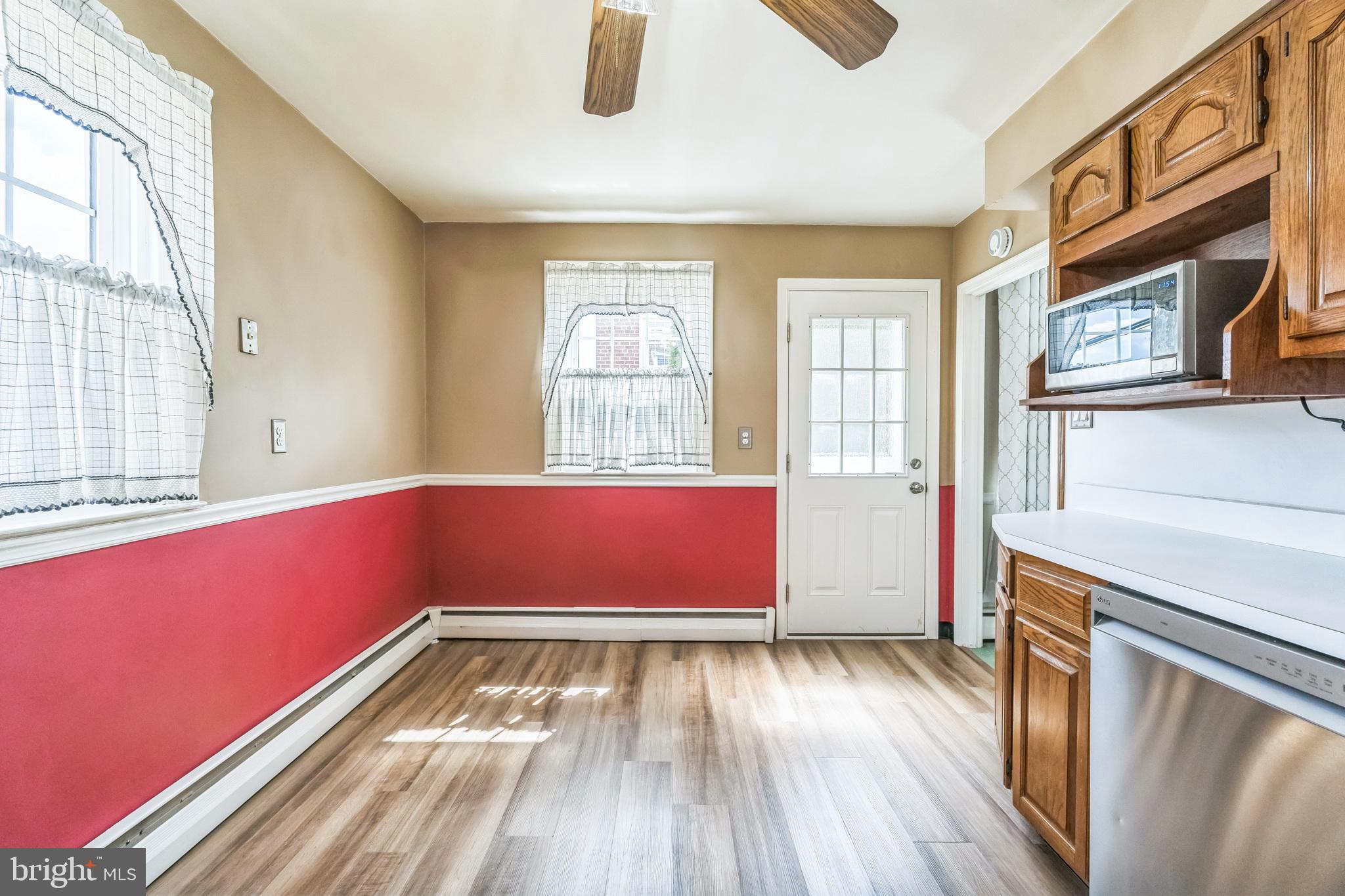 855 Medway Road Philadelphia, PA 19115 - Photo 10 of 30 a view of an empty room with wooden floor and a window