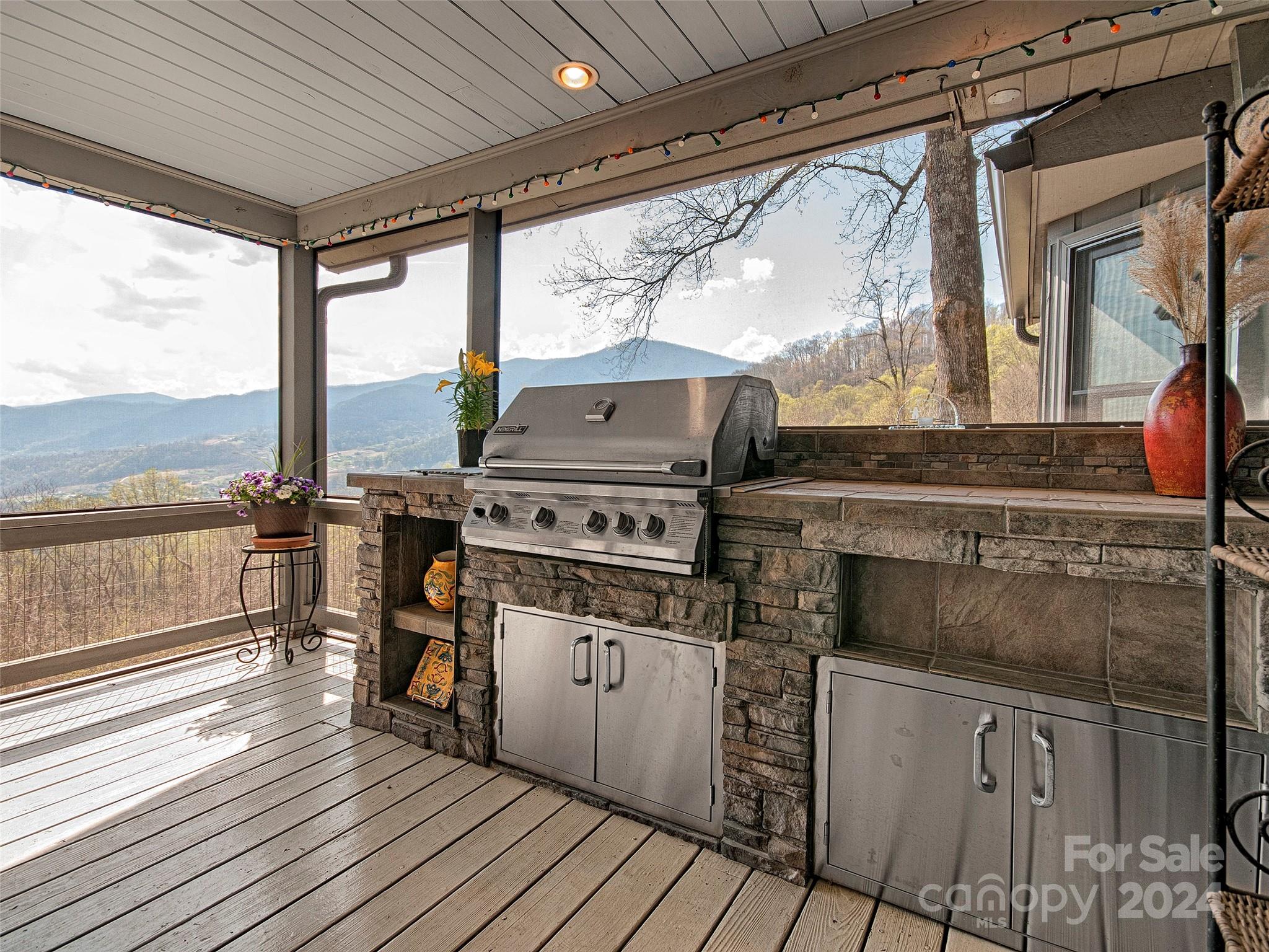 436 Old Fiddle Road Waynesville, NC 28786 - Photo 15 of 18 a kitchen with appliances cabinets and a large window