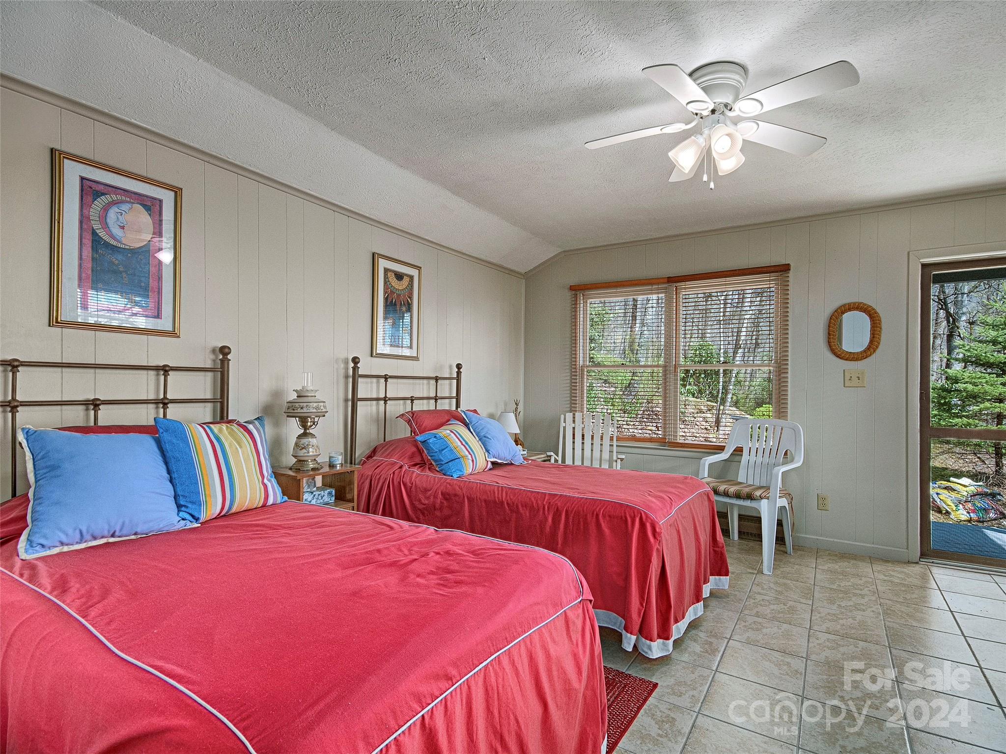 436 Old Fiddle Road Waynesville, NC 28786 - Photo 16 of 18 a bedroom with two beds and a chandelier