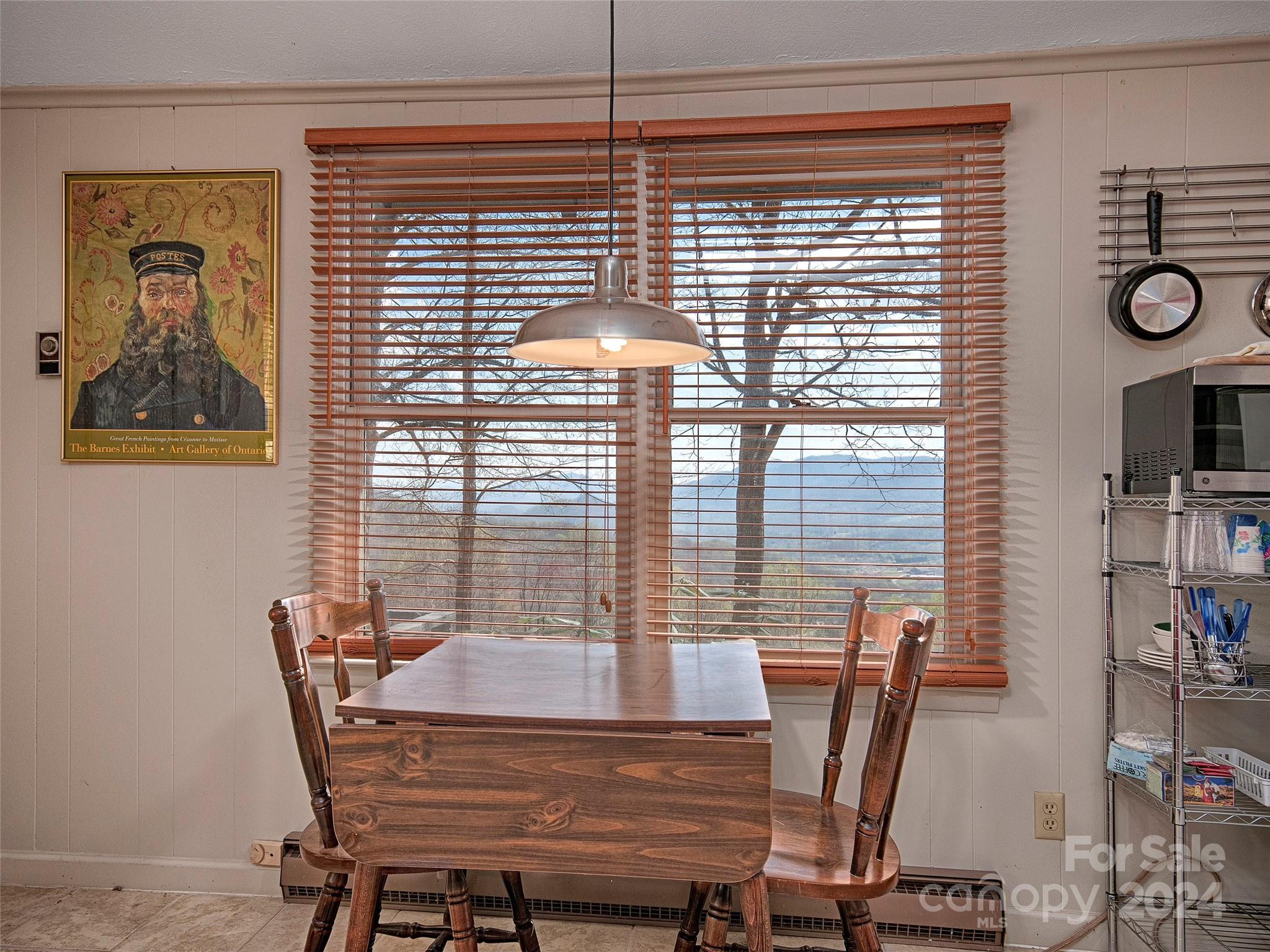 436 Old Fiddle Road Waynesville, NC 28786 - Photo 18 of 18 a view of a dining room with furniture and window