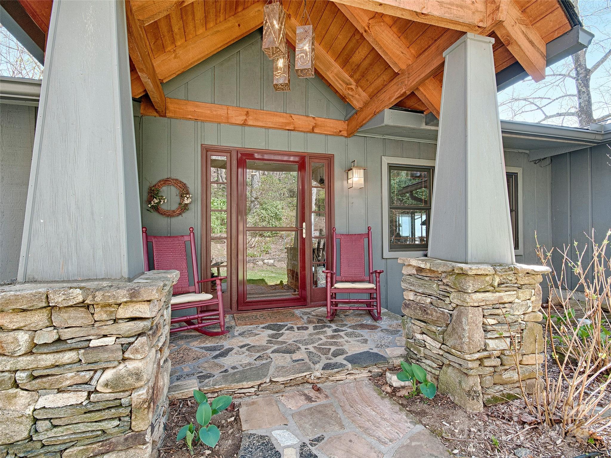 436 Old Fiddle Road Waynesville, NC 28786 - Photo 2 of 18 a front view of a house with outdoor seating