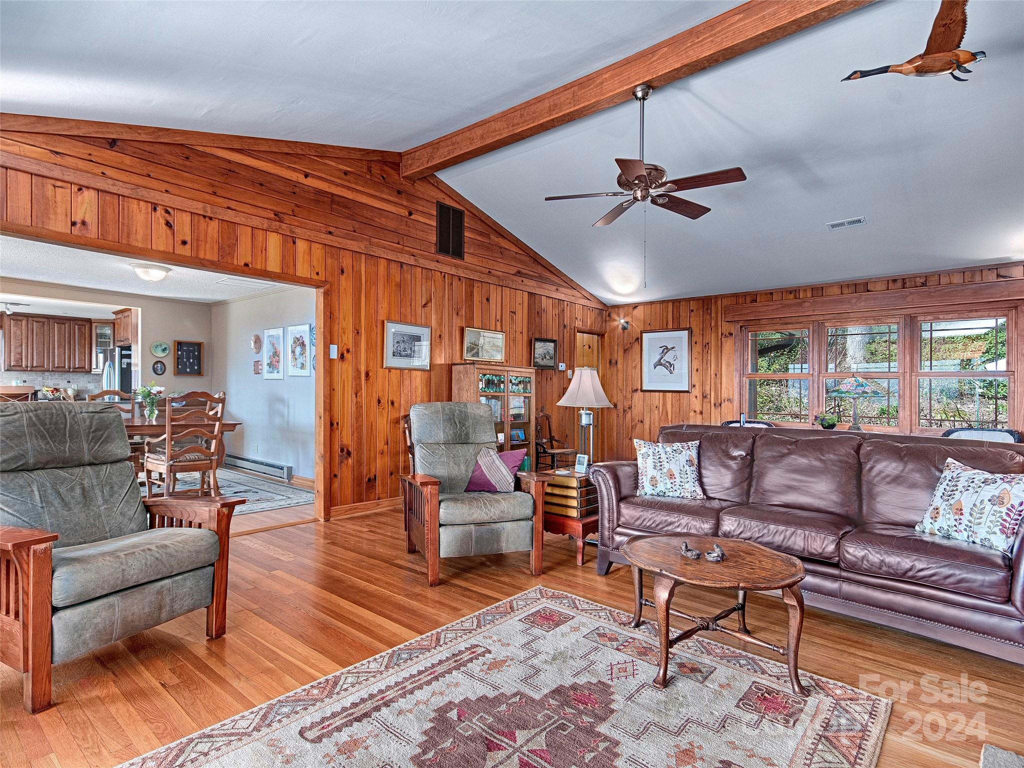 436 Old Fiddle Road Waynesville, NC 28786 - Photo 4 of 18 a living room with furniture a ceiling fan and a rug