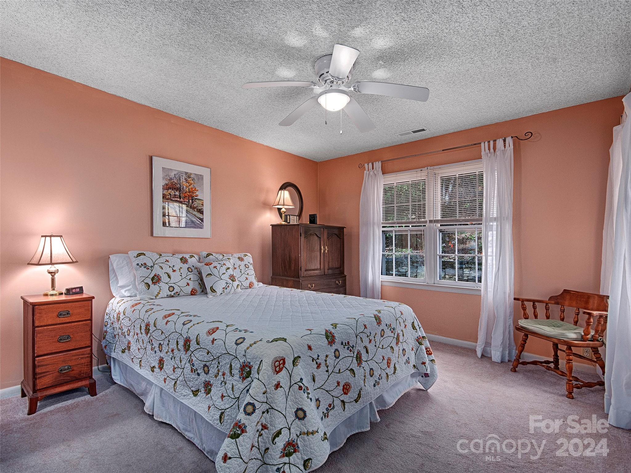 436 Old Fiddle Road Waynesville, NC 28786 - Photo 9 of 18 a bedroom with a large bed and a window