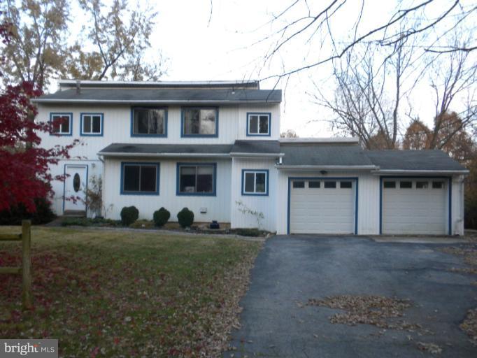 14409 Sturtevant Road Silver Spring, MD 20905 - Photo 2 of 30 a front view of a house with a yard