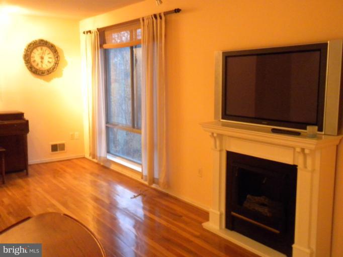 14409 Sturtevant Road Silver Spring, MD 20905 - Photo 13 of 30 a view of livingroom with furniture and wooden floor