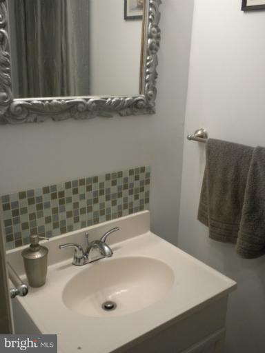 14409 Sturtevant Road Silver Spring, MD 20905 - Photo 19 of 30 a bathroom with a sink and a mirror