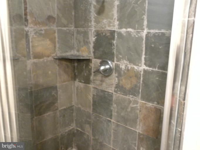 14409 Sturtevant Road Silver Spring, MD 20905 - Photo 26 of 30 a bathroom with a glass shower door