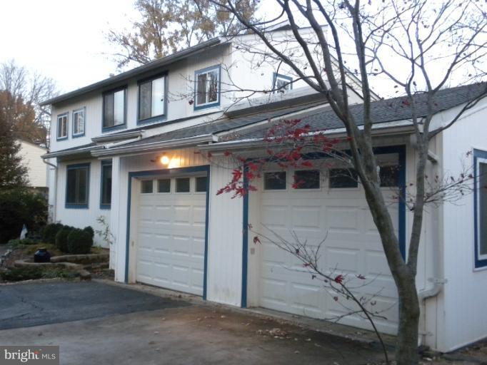 14409 Sturtevant Road Silver Spring, MD 20905 - Photo 4 of 30 a front view of a house with a tree
