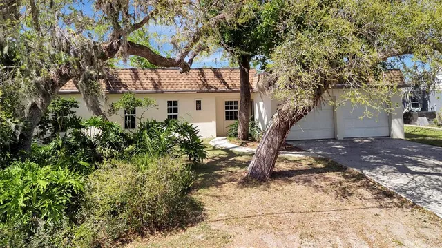 a view of a house with a tree