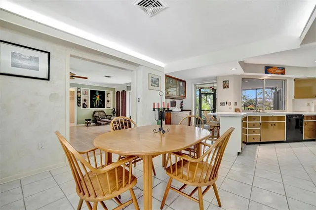 a dining room with furniture and window