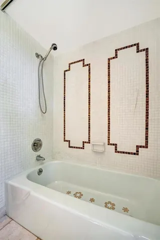 a bathroom with a bath tub and a shower