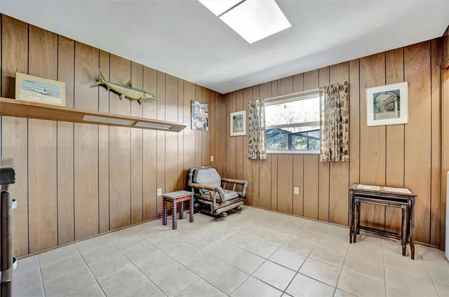 a view of room with furniture and a window