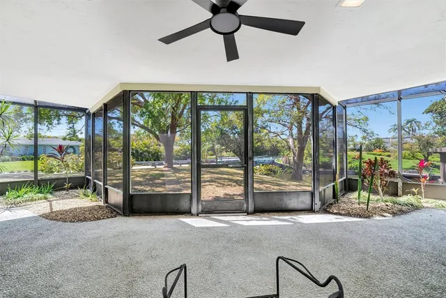 a view of a room with wooden floor and windows