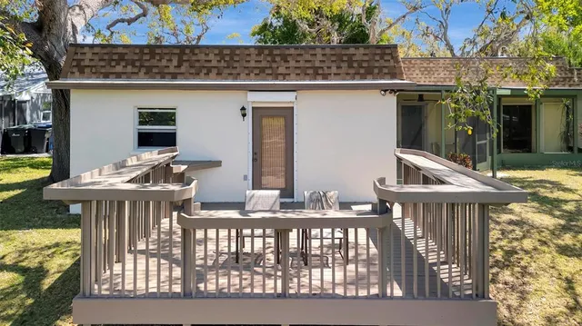 a view of a chairs and table in patio