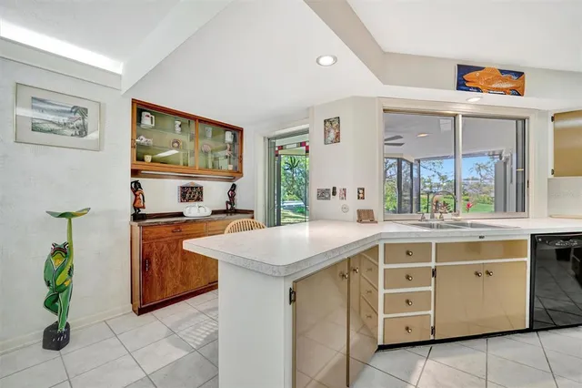 a kitchen with stainless steel appliances granite countertop a sink and a stove