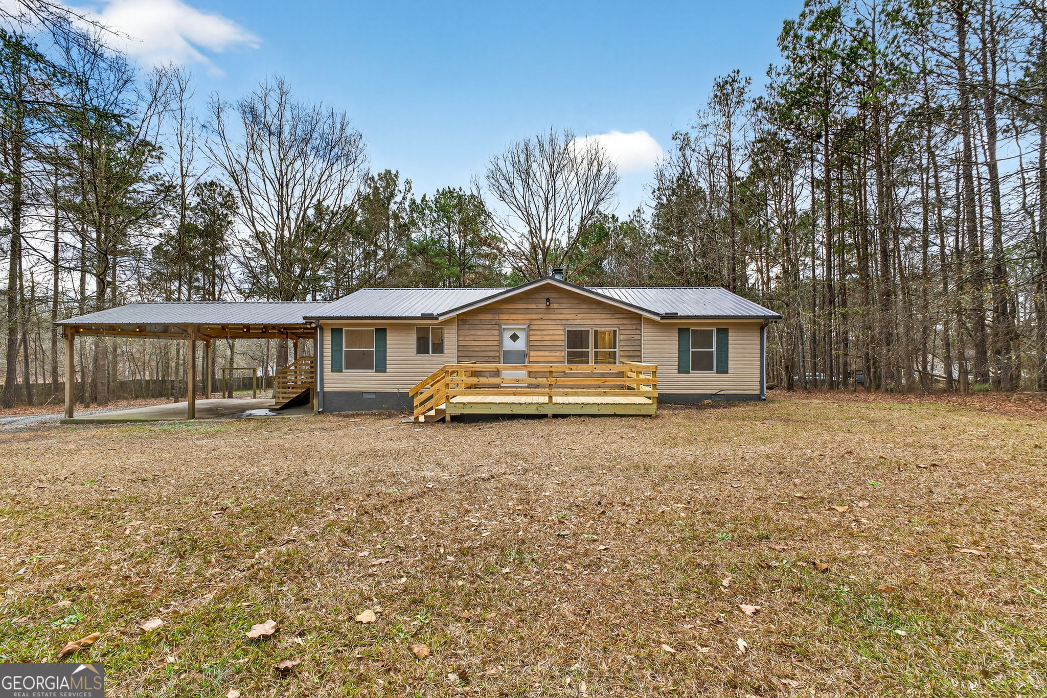 459 Hay Road Meansville, GA 30256 - Photo 2 of 36 a front view of a house with a yard