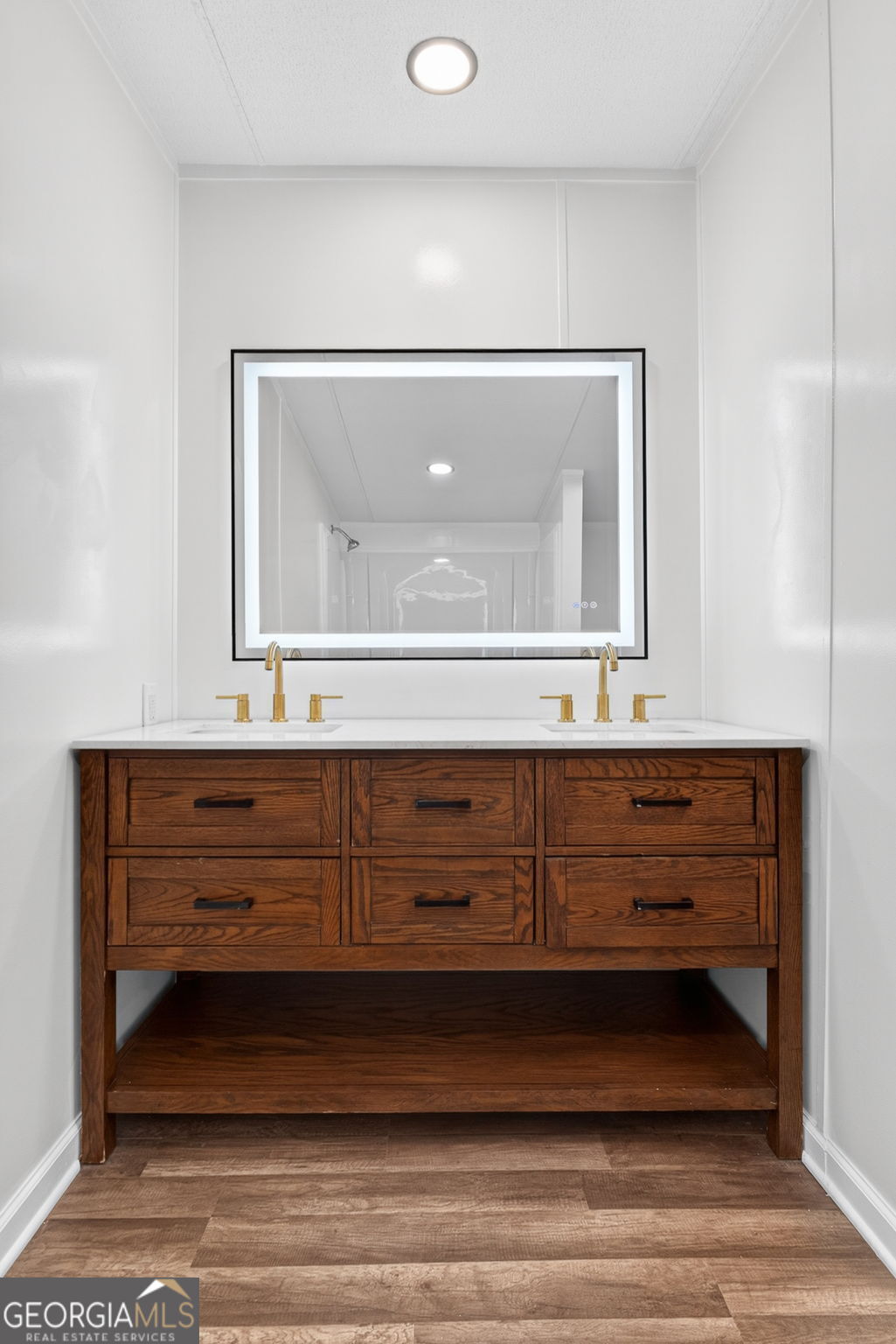 459 Hay Road Meansville, GA 30256 - Photo 22 of 36 a bathroom with a sink and mirror
