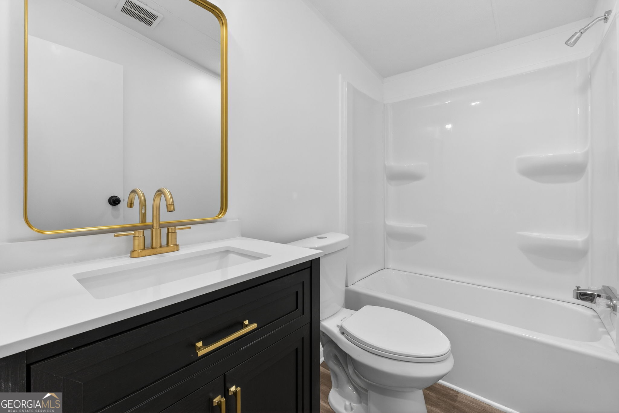 459 Hay Road Meansville, GA 30256 - Photo 27 of 36 a bathroom with a sink a toilet and shower