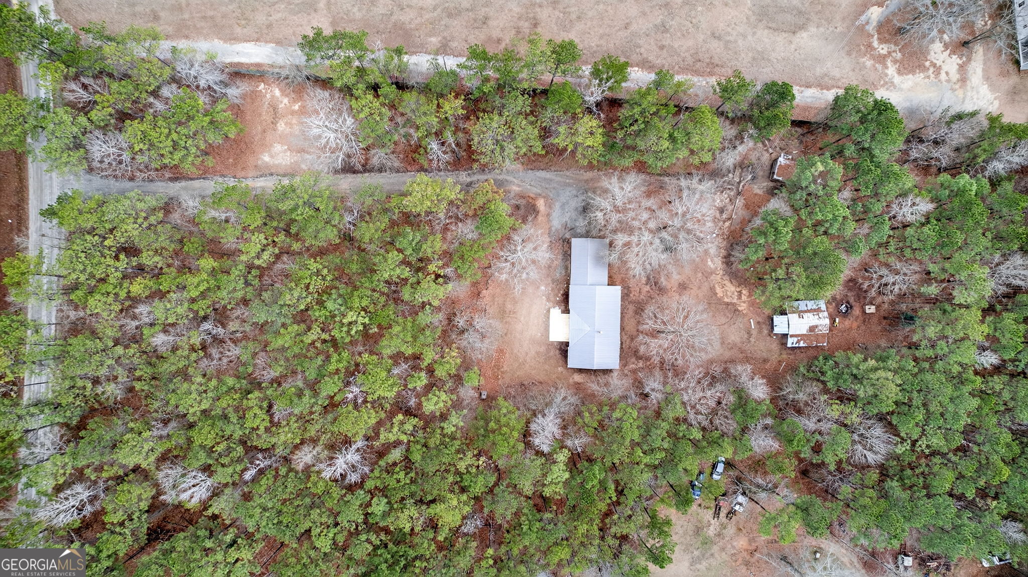 459 Hay Road Meansville, GA 30256 - Photo 32 of 36 an aerial view of a house with a yard and large tree