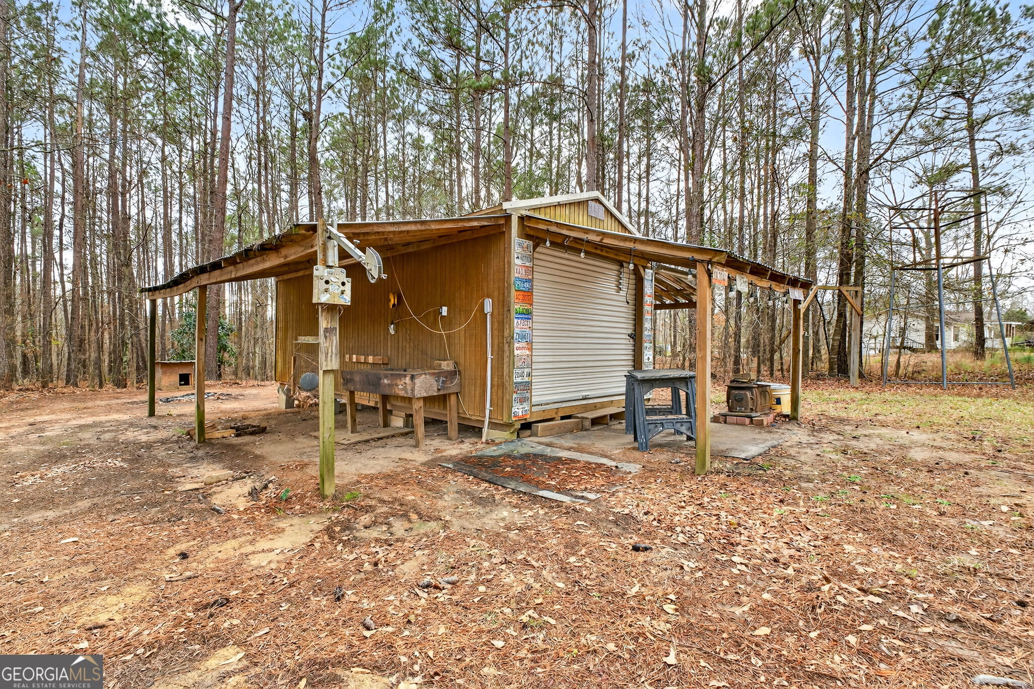 459 Hay Road Meansville, GA 30256 - Photo 10 of 36 a view of a house with backyard and a tree