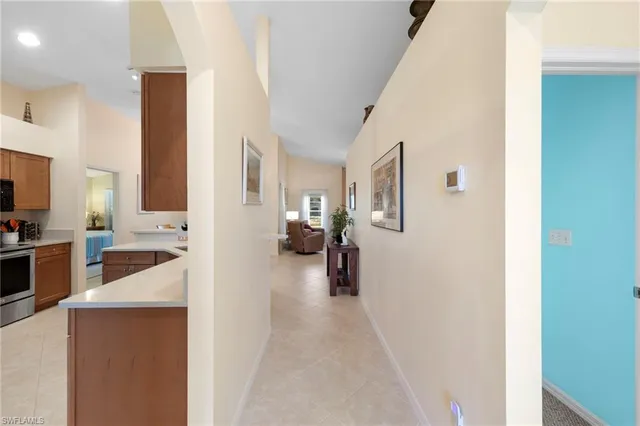 a view of a living room with furniture and a view of kitchen