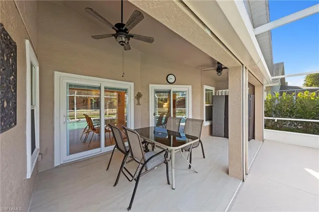 a dining room with furniture and front door