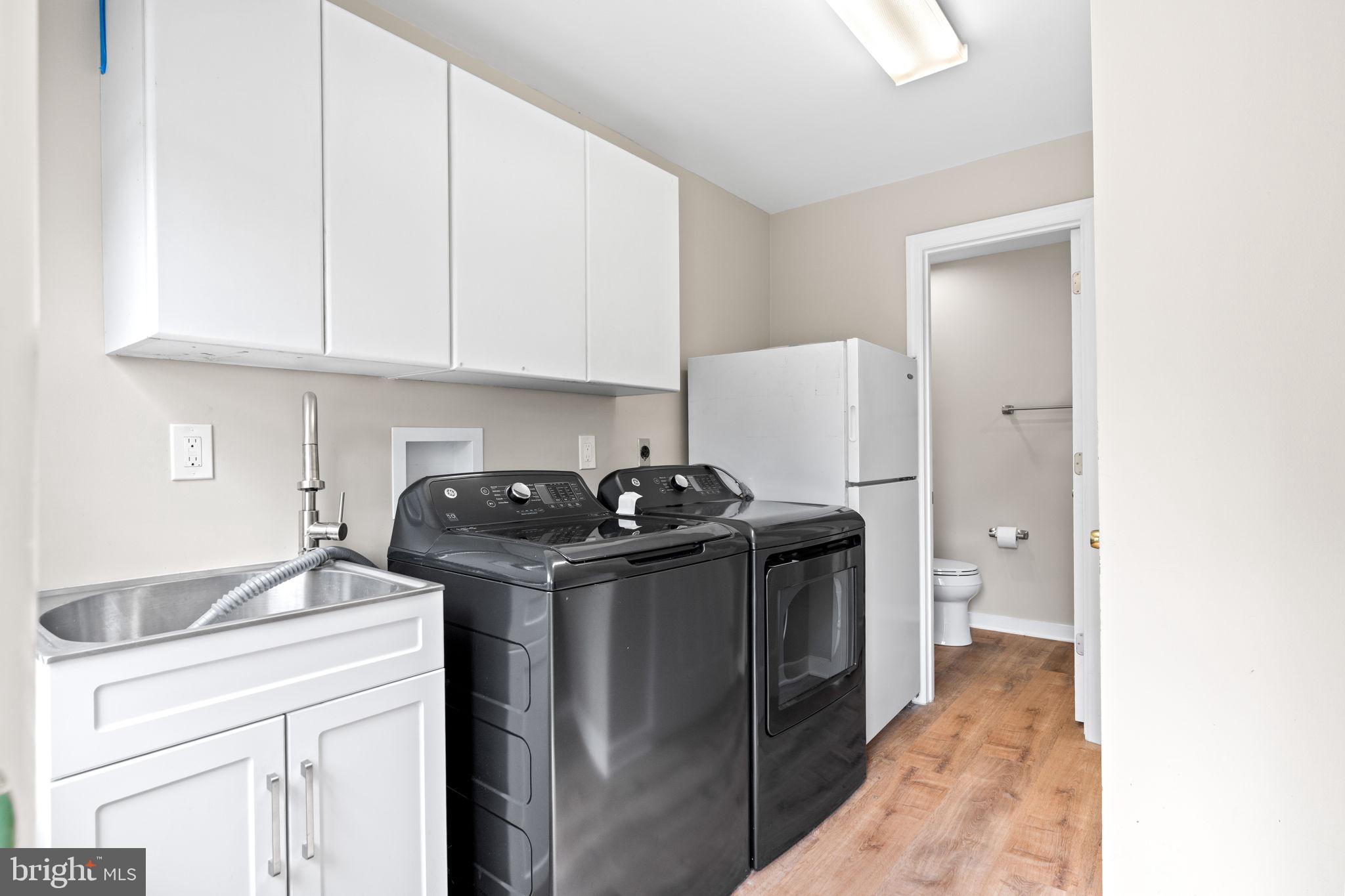 5002 Burkittsville Road Jefferson, MD 21755 - Photo 14 of 40 Modern laundry space with sleek appliances.