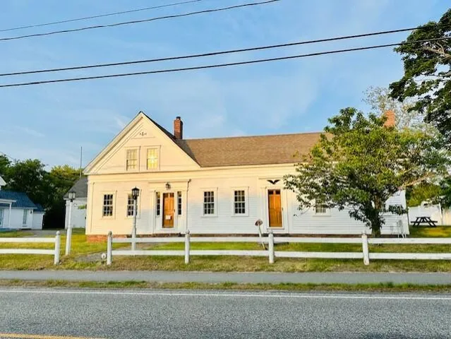 a view of swimming pool with house in background