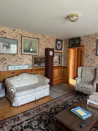 a living room with furniture and a rug