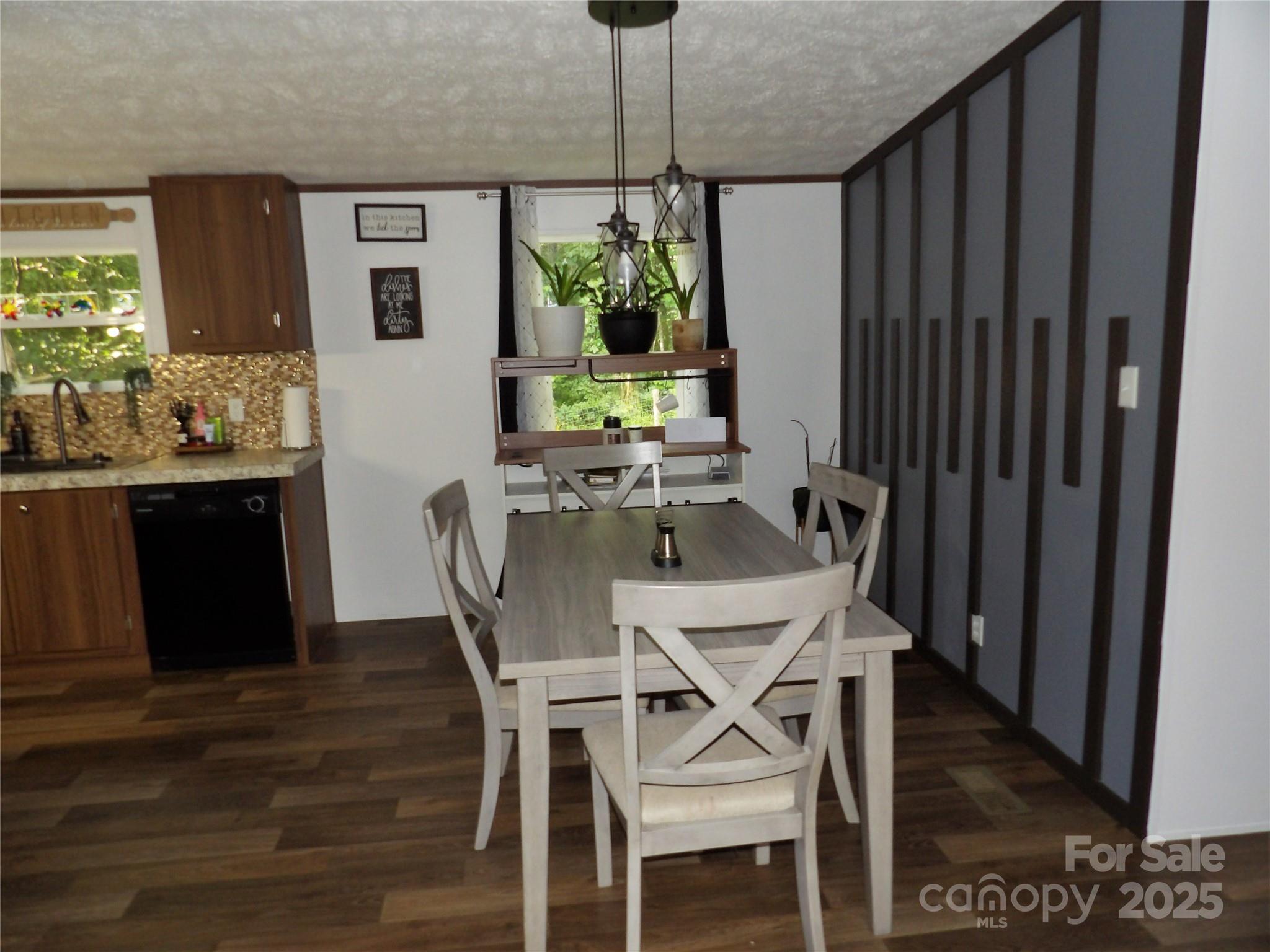 31 McGee Hl Road Fairview, NC 28730 - Photo 13 of 21 a dining room with furniture window and wooden floor
