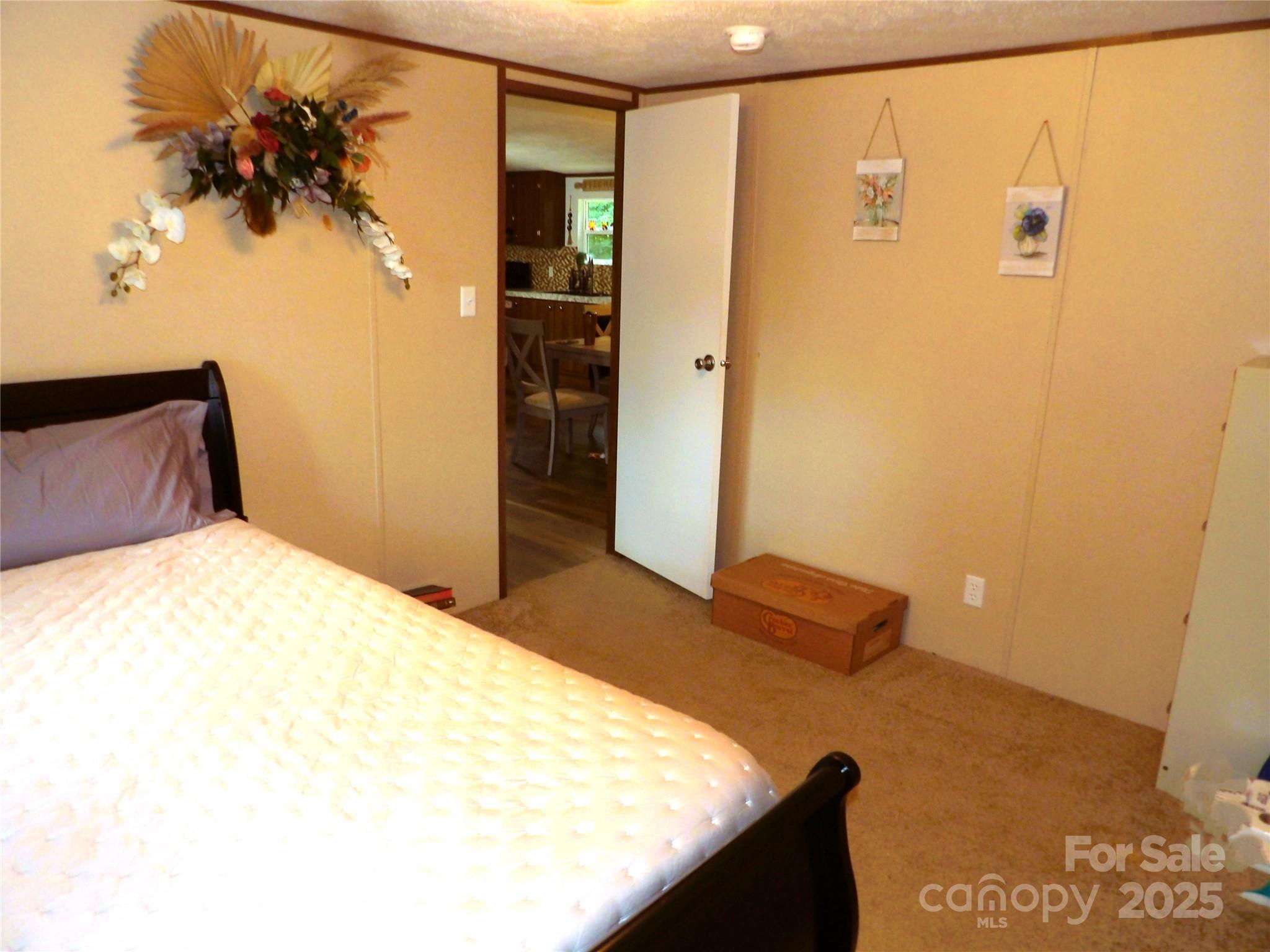 31 McGee Hl Road Fairview, NC 28730 - Photo 16 of 21 a bedroom with a bed and a painting on the wall