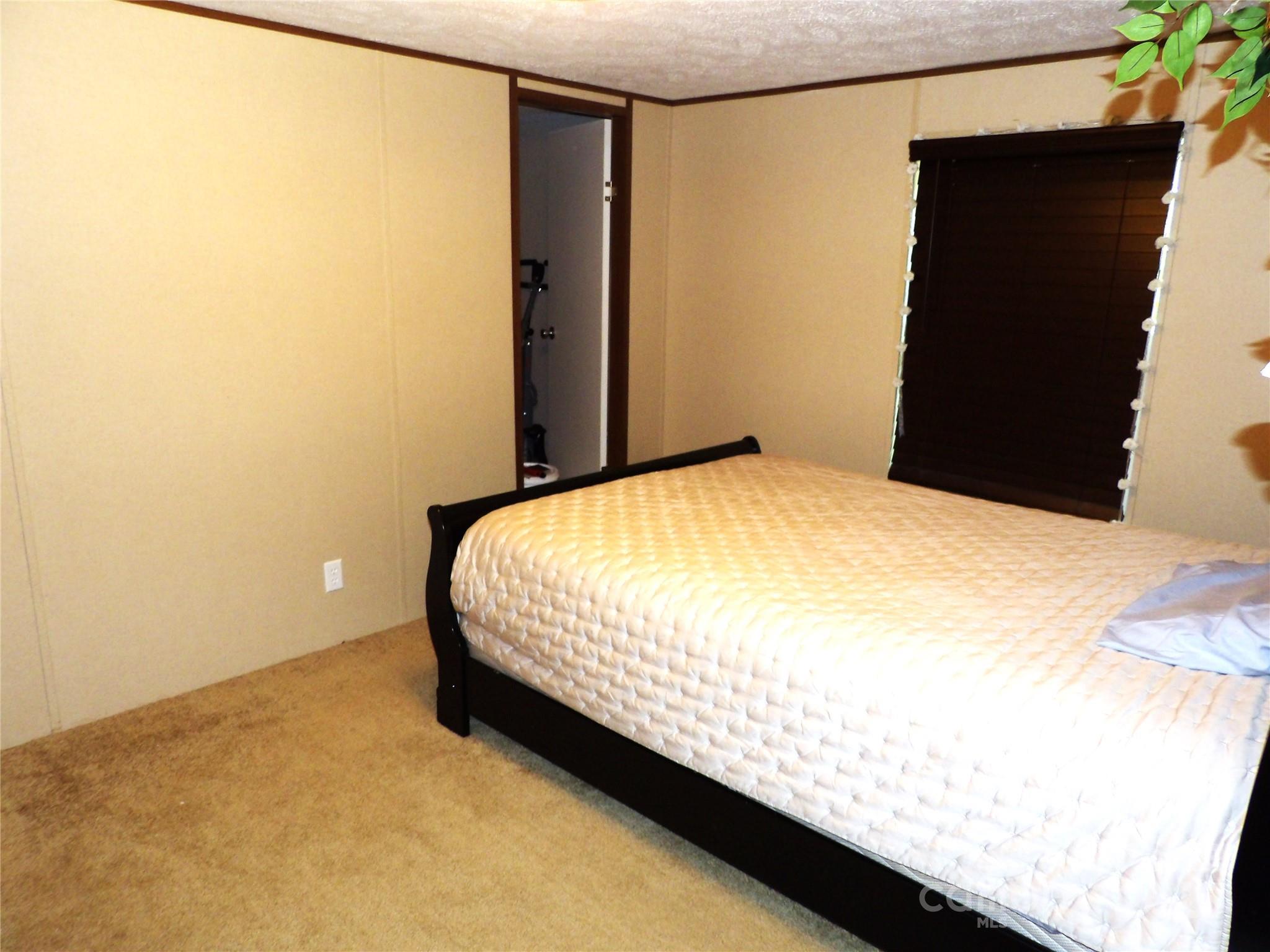 31 McGee Hl Road Fairview, NC 28730 - Photo 17 of 21 a bedroom with a bed and a wall painting