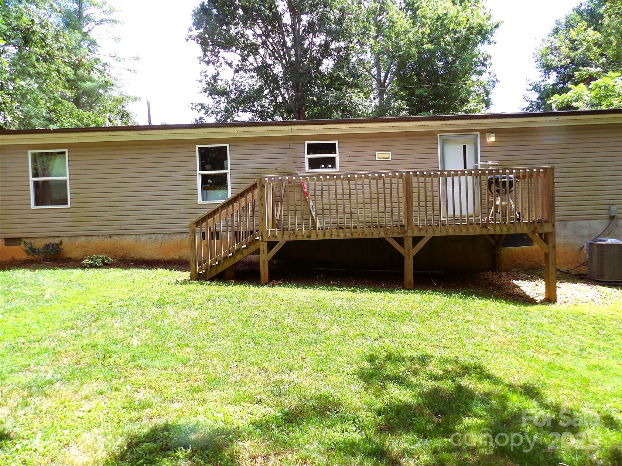 31 McGee Hl Road Fairview, NC 28730 - Photo 2 of 21 a view of a backyard with a wooden fence