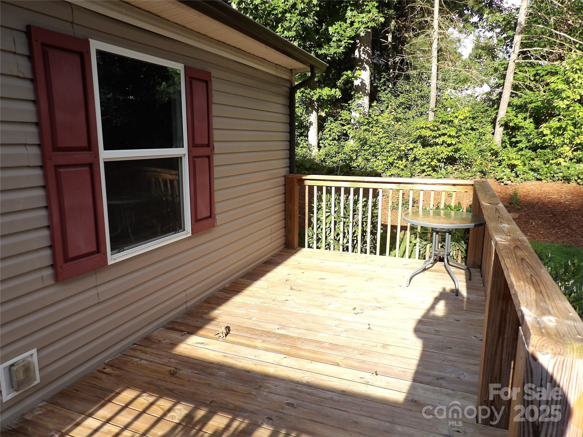 31 McGee Hl Road Fairview, NC 28730 - Photo 4 of 21 a view of a balcony with wooden floor