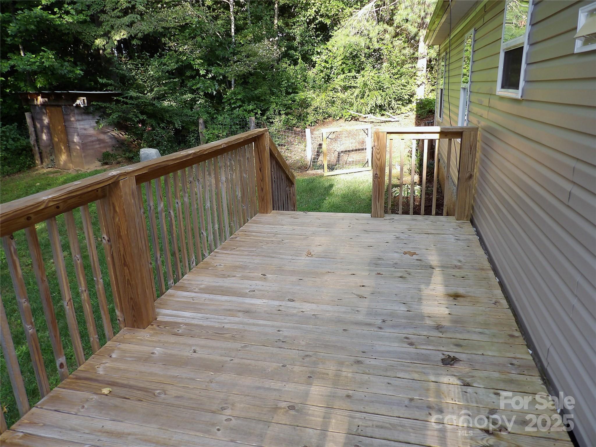 31 McGee Hl Road Fairview, NC 28730 - Photo 5 of 21 a balcony with trees in front of it