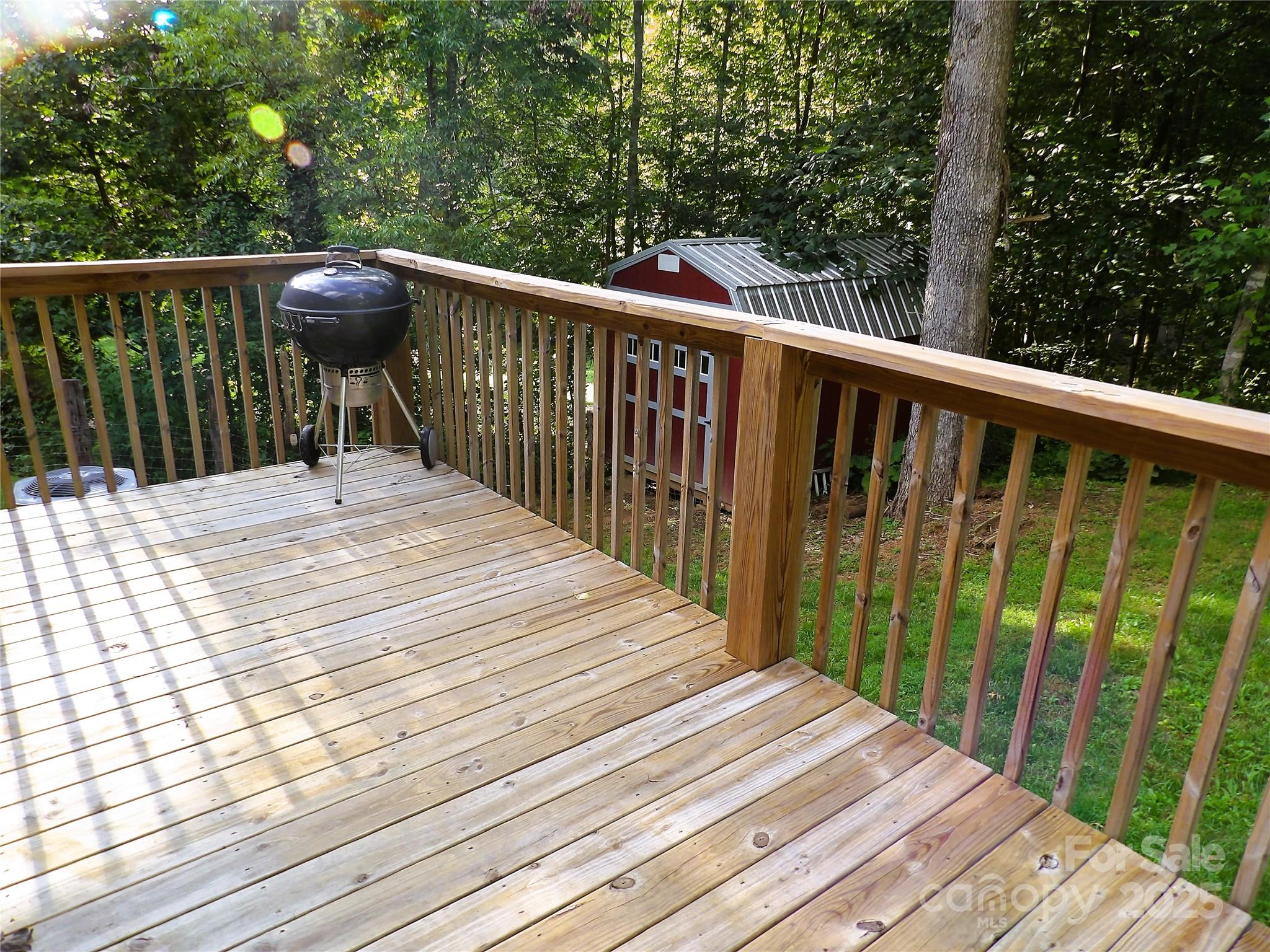 31 McGee Hl Road Fairview, NC 28730 - Photo 6 of 21 a balcony with wooden floor and fence
