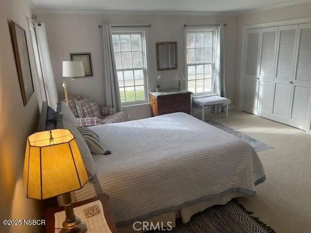 a bedroom with a bed and lamp