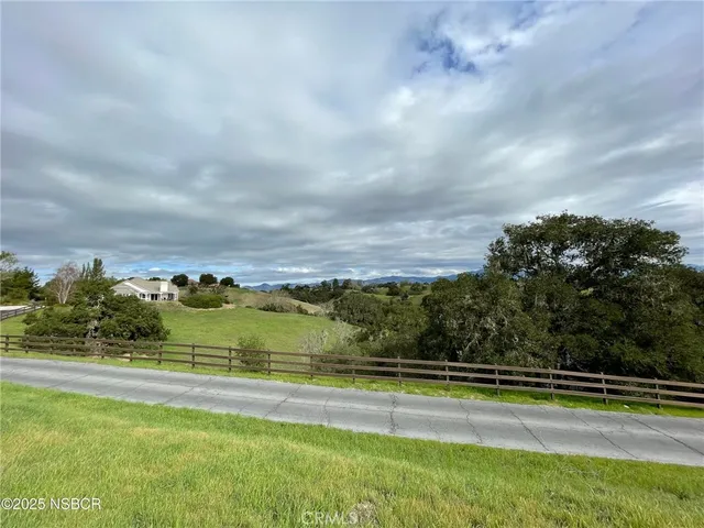 a view of swimming pool with trees in the background