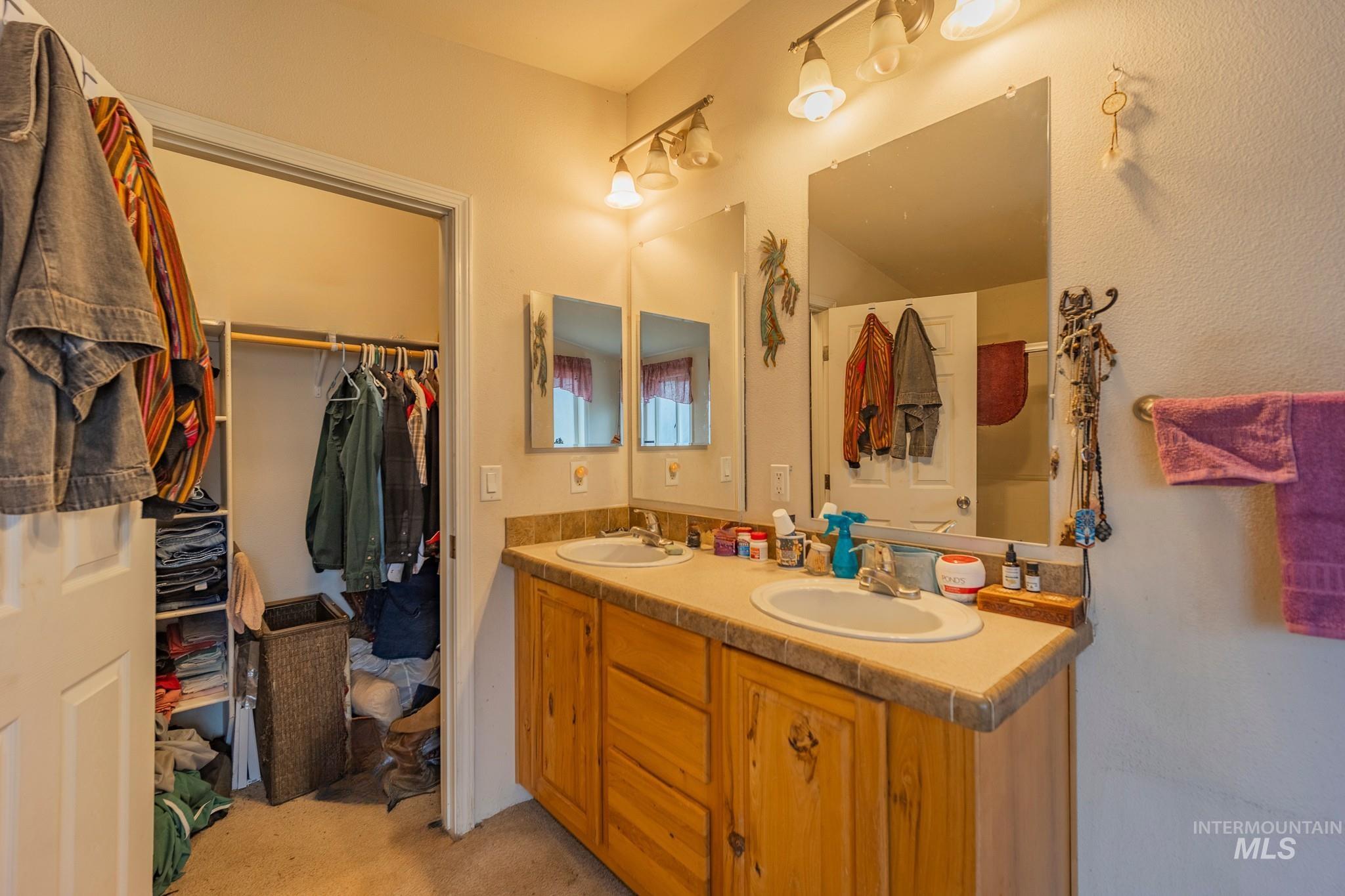 3608 Highway 13 Stites, ID 83552 - Photo 31 of 44 Bathroom featuring double vanity and a spacious closet