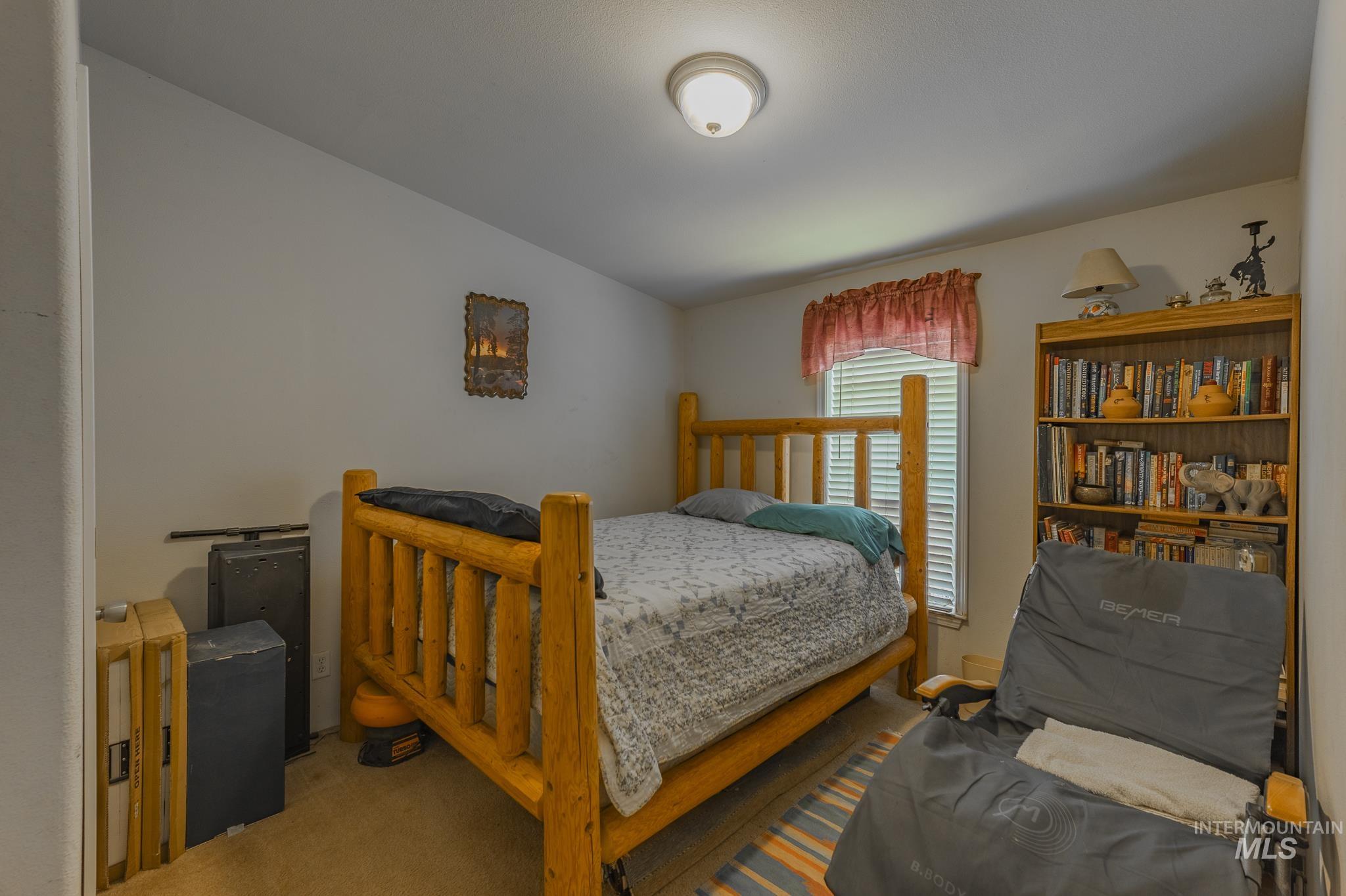 3608 Highway 13 Stites, ID 83552 - Photo 34 of 44 Carpeted bedroom featuring vaulted ceiling