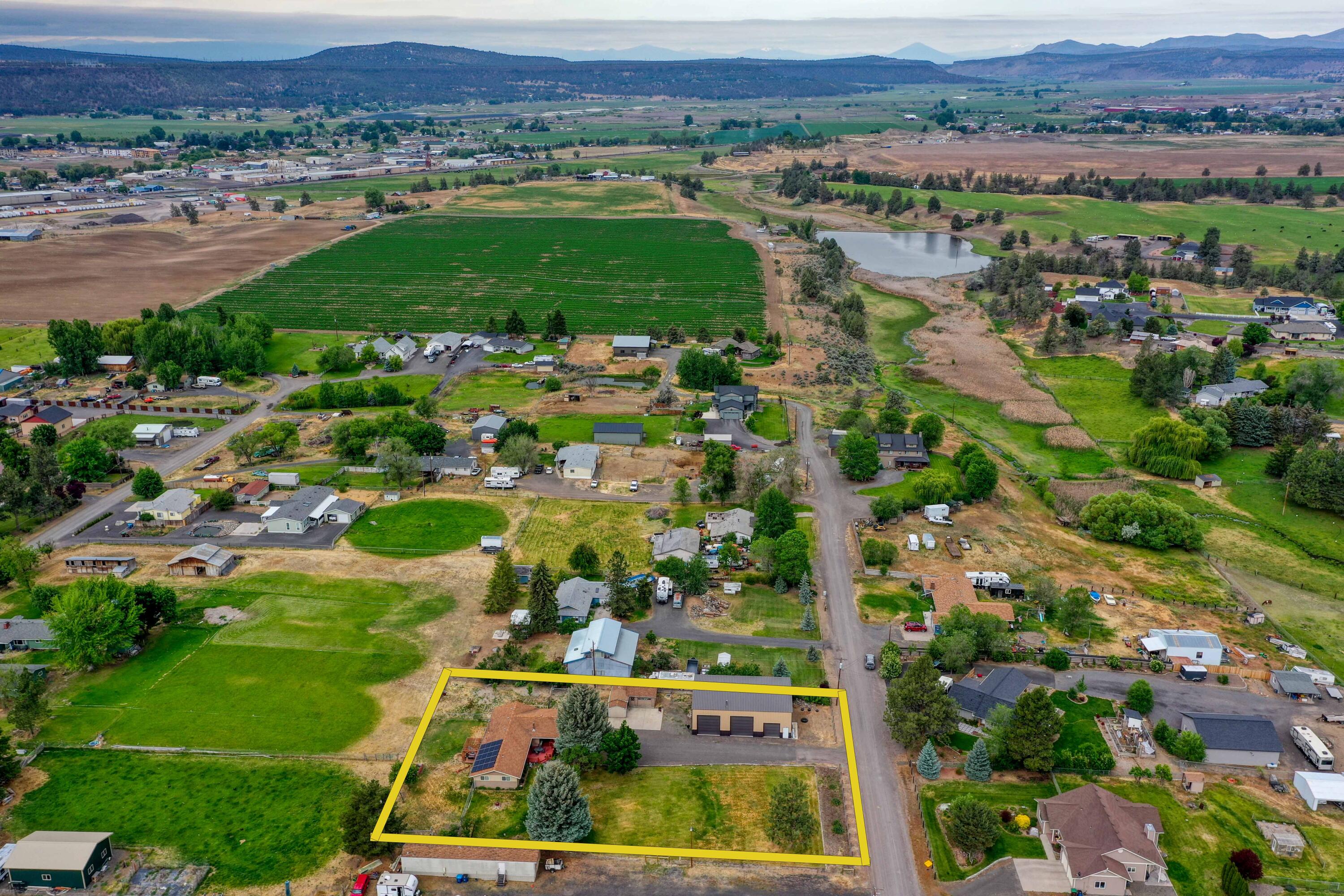 566 Northwest Mc Donald Road Prineville, OR 97754 - Photo 23 of 41 an aerial view of residential houses with outdoor space and trees